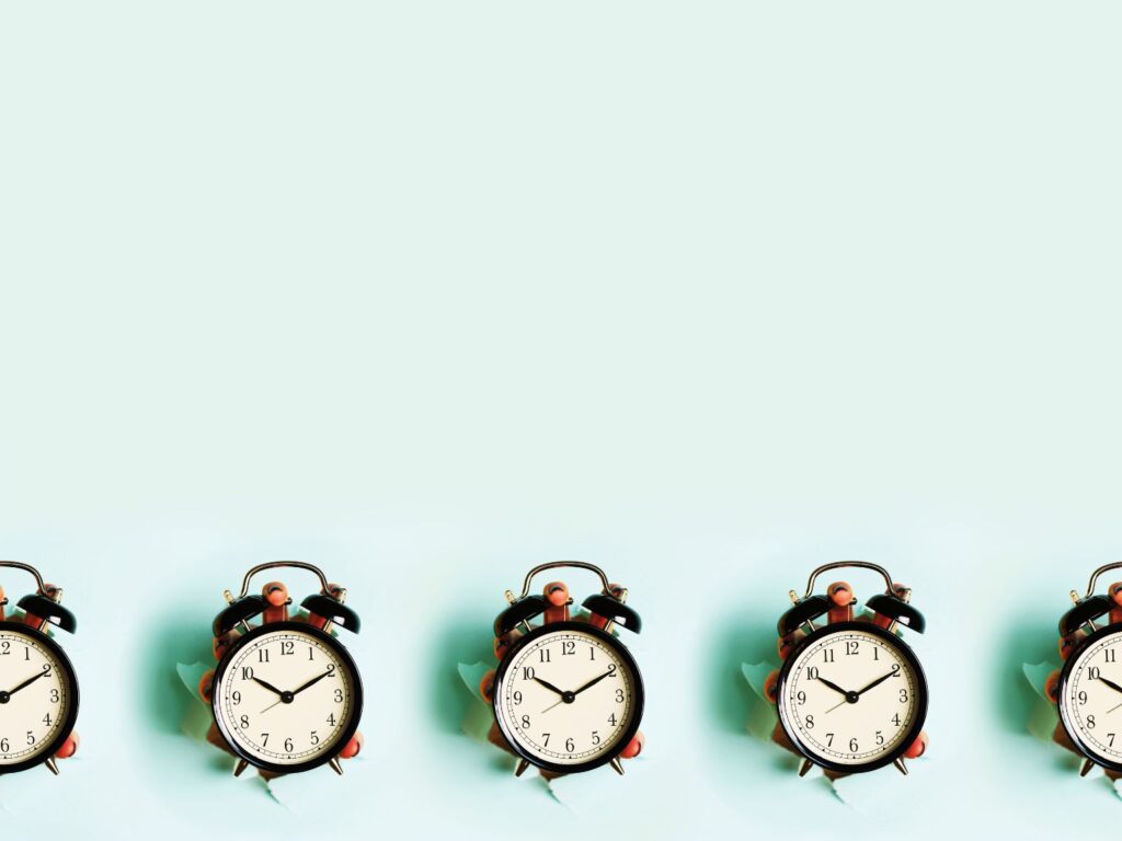 There are alarm clocks in a row. 